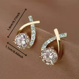Boucles d'oreilles à puce avec croix dorée et zirconiums