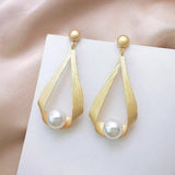 Boucles d'oreilles avec des cristaux et des perles rondes