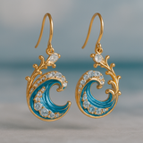 Boucles d'oreilles dorées avec des vagues rayonnantes
