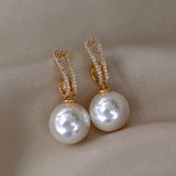 Boucles d'oreilles élégantes avec perles et zirconium