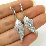Boucles d'oreilles en argent avec des ailes scintillantes