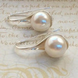 Boucles d'oreilles en forme de goutte avec des marguerites