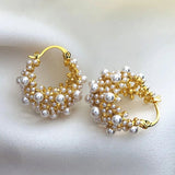 Boucles d'oreilles en or au design vintage avec perles