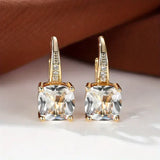 Boucles d'oreilles en or avec des pierres mystérieuses