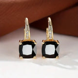 Boucles d'oreilles en or avec des pierres mystérieuses