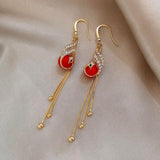 Boucles d'oreilles festives avec des marguerites bleues | Or
