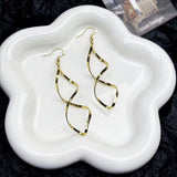Boucles d'oreilles pendantes en spirale | Or