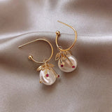 Boucles d'oreilles rétro en or avec perle de cerise