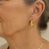 Boucles d'oreilles vintage roue avec fleur en or