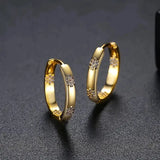 Boucles d'oreilles vintage roue avec fleur en or