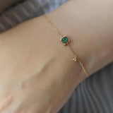 Bracelet en or avec cristal vert