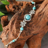 Bracelet en or blanc avec des papillons