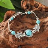 Bracelet en or blanc avec des papillons