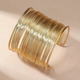 Bracelet ouvert avec spirale | Or