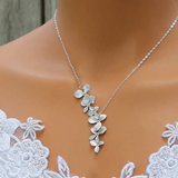 Collier et boucles d'oreilles en forme de fleurs | Argent