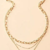 Collier rétro avec des couches de chaîne et pendentif doré