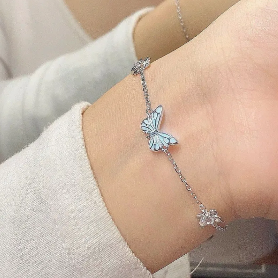 Ensemble collier et bracelet avec papillon bleu lumineux | Or