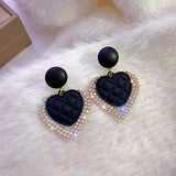 Boucles d'oreilles en cœur noir en or