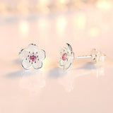 Boucles d'oreilles à bouton en forme de fleur avec zirconiums