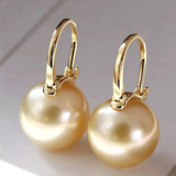 Boucles d'oreilles élégantes en or avec perles